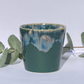 Load image into Gallery viewer, Aromatherapy candle in a deep hunter green stoneware coffee cup, crafted with natural wax and essential oils. Handmade by Kilimanjaro Candles & More for a luxurious, eco-friendly touch.
