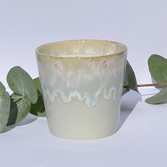 Handmade aromatherapy candle in a grey stoneware coffee cup, featuring natural wax and essential oils. A sustainable, artisan candle by Kilimanjaro Candles & More.